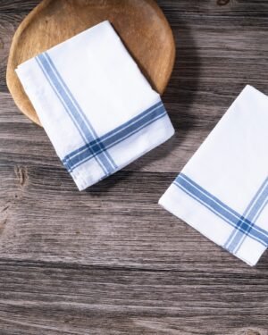 TerraKlay's White napkins with blue stripes on a wooden surface