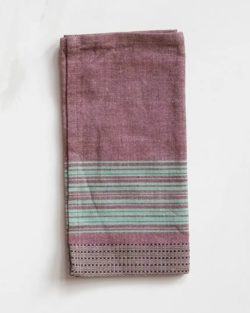 TerraKlay's brown cotton dinner napkin with teal stripes.