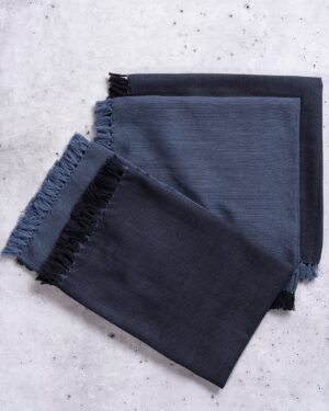 Double sided cloth dinner napkins in blue and black blue with frayed edges by TerraKlay linen collection